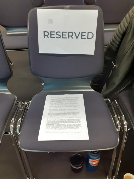 Chair with 'reserved' sign